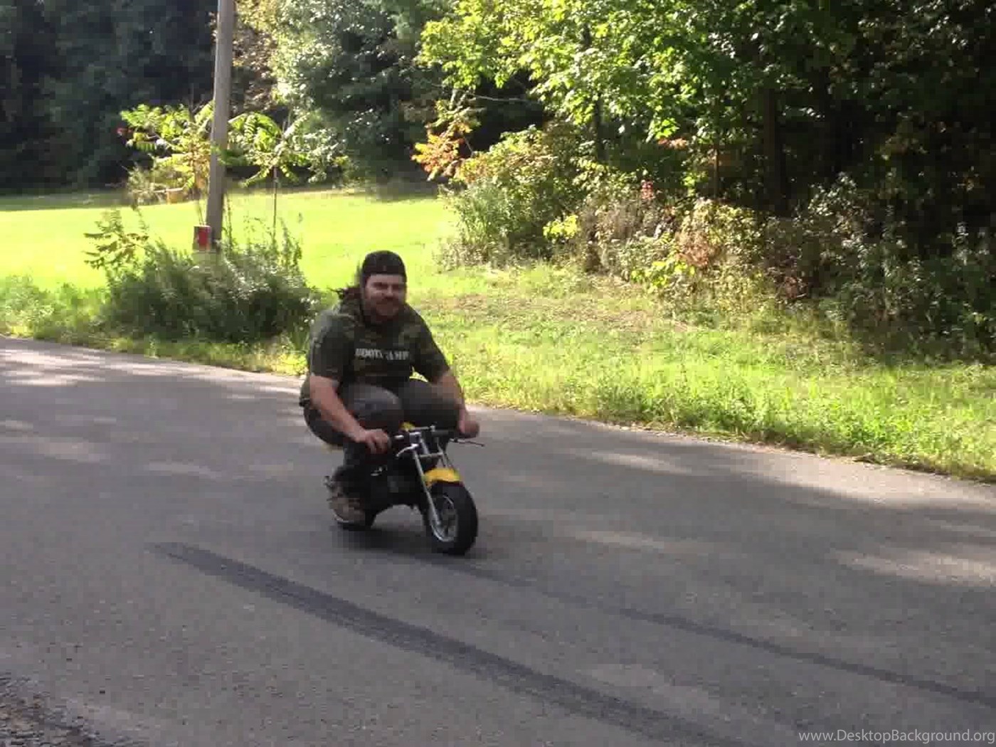 fat man on mini bike