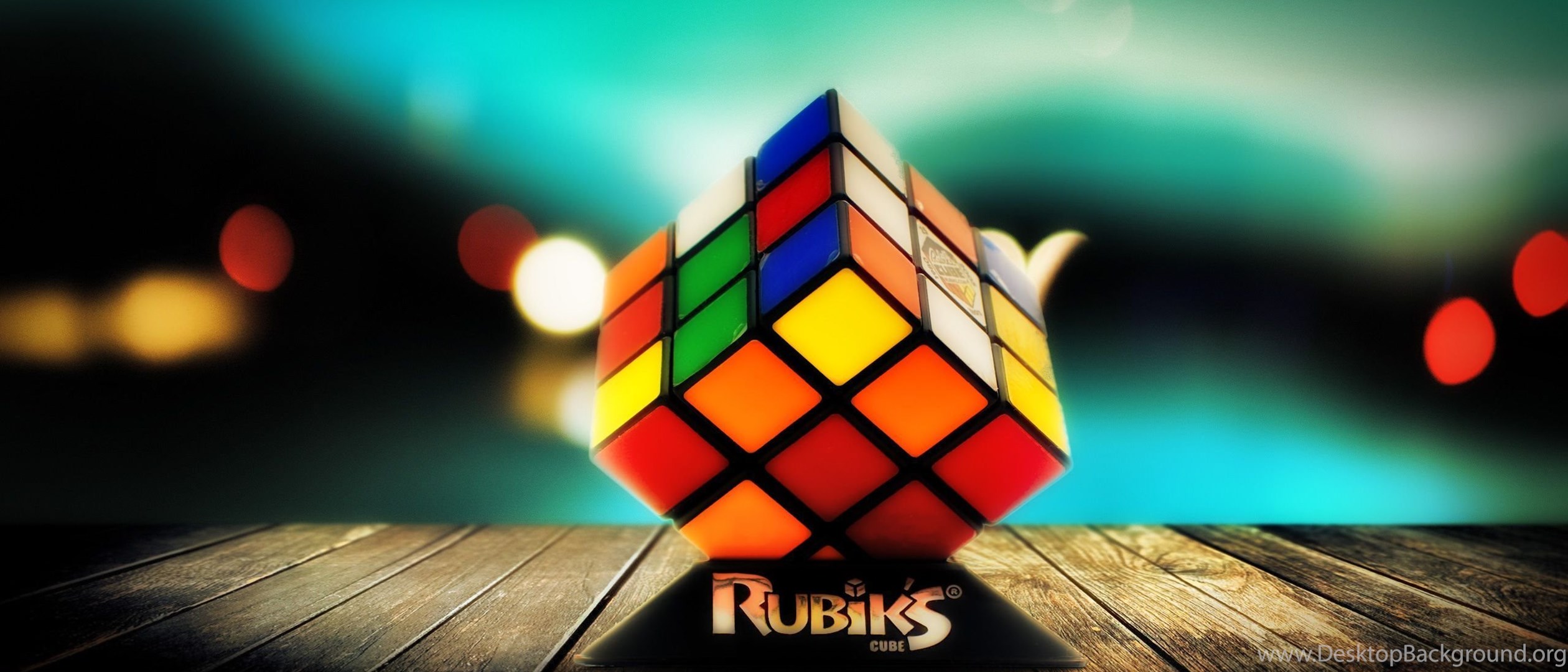 Играть в дзен 3d кубик. Кубик рубик фон. Кубик Рубика на оранжевом фоне. Обои на рабочий стол кубик рубик. Слайд с фоном кубик рубик.