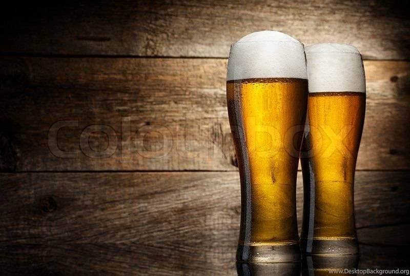 Two People Holding A Beer Glass Against White Backgrounds