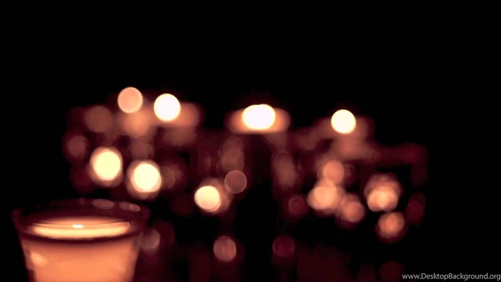 Free Video Backgrounds Defocused Candles Behind Glowing Candle ...