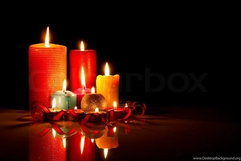 A Single Burning Old Round Yellow Candle With Selective Focus On ...