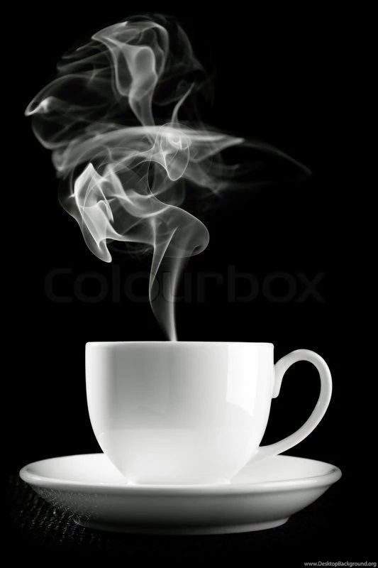 Coffee Cup Over The Table Against Black Backgrounds