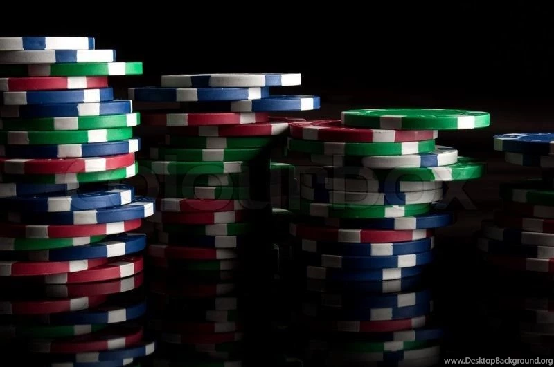 Many Poker Chips On A Black Backgrounds
