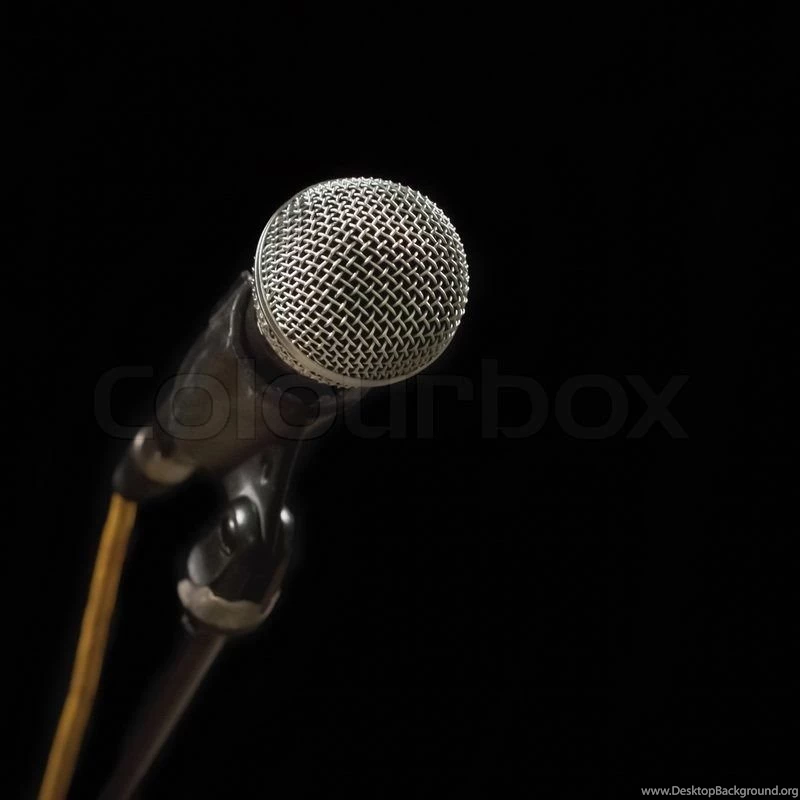 Classic Black Microphone On Black Stand. Isolated Black Backgrounds ...