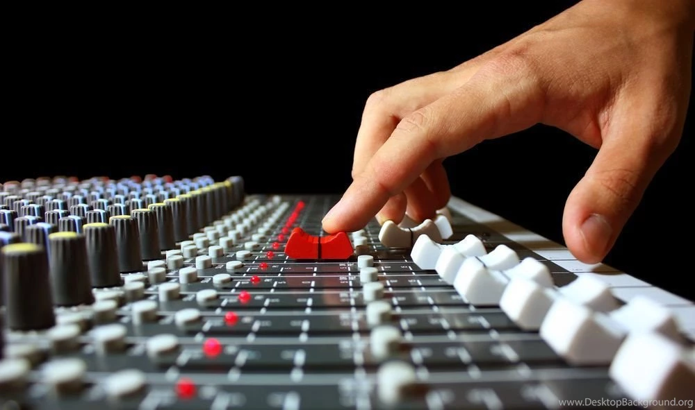 Recording studio mixer wallpaper finger on mixer fader.jpg