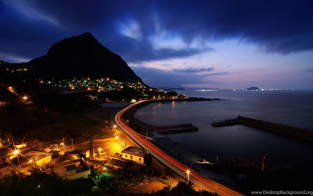 Some Kind Of Cove Or Harbour At Night With A Mountain In The ...