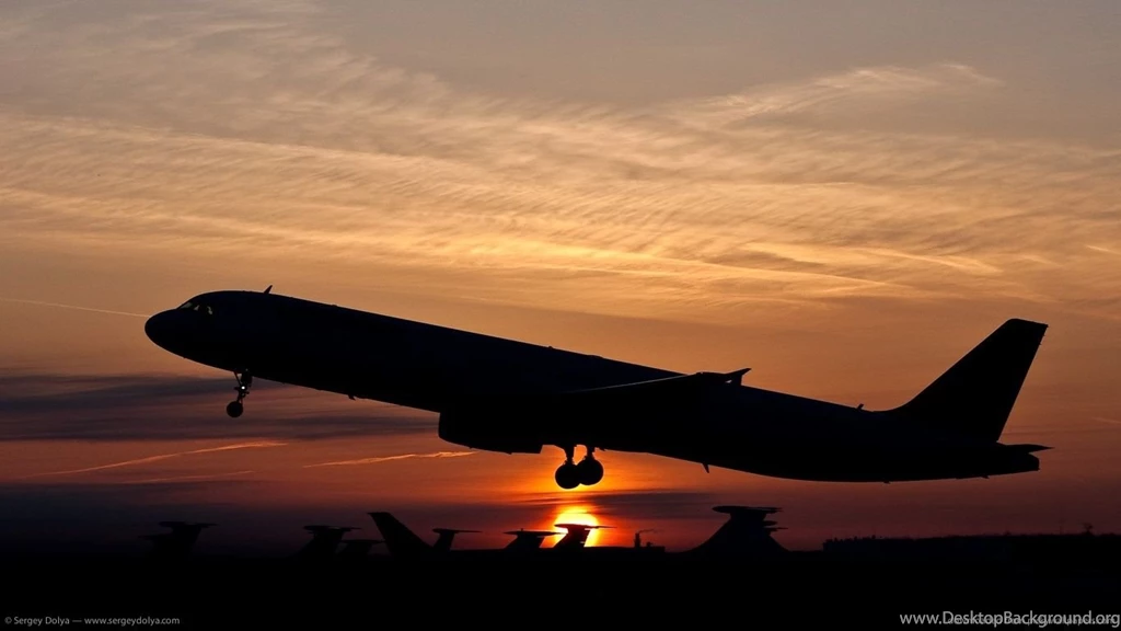 Download 1366x768 Silhouette Of An Ascending Plane Wallpapers