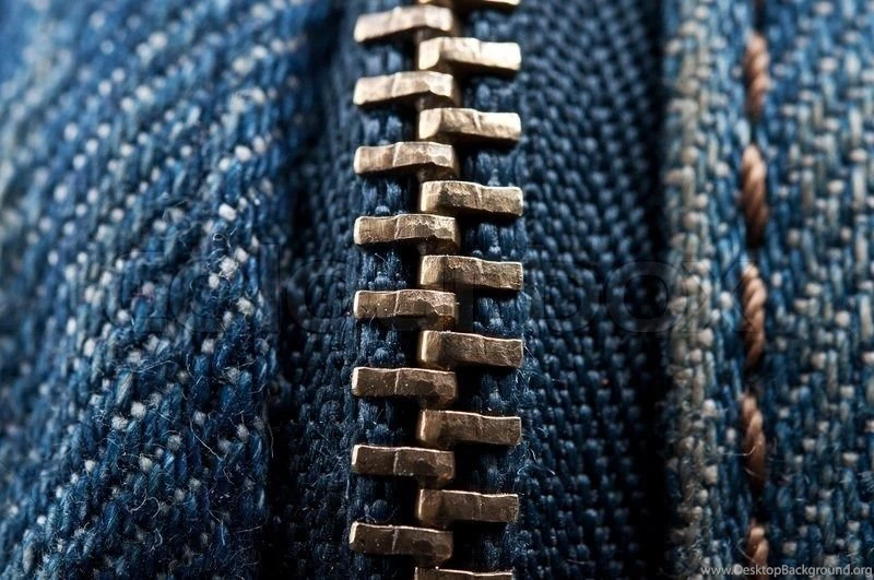 Closeup Of Zipper On Jeans Clothing Backgrounds