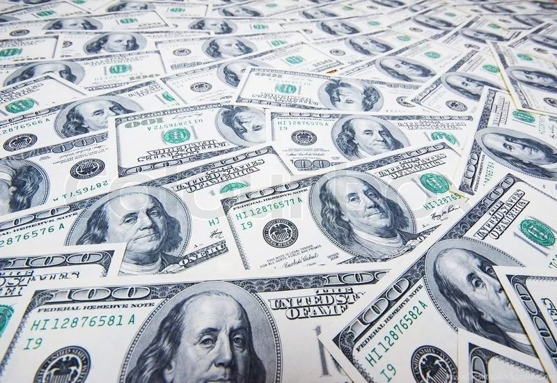 Stack Of Dollars On Money Backgrounds Stock Photo