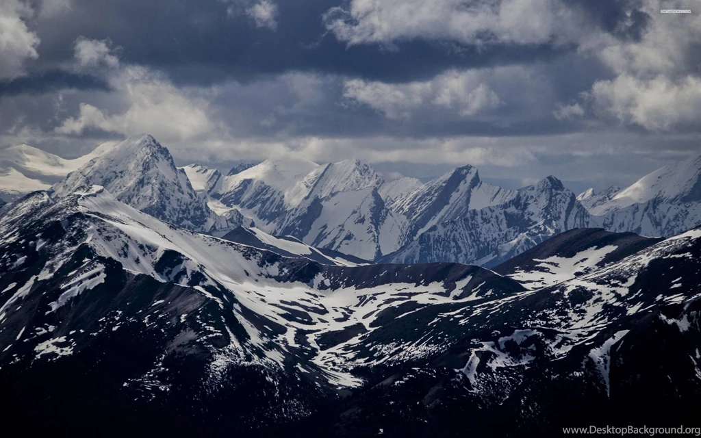 Grey Clouds Above The Rocky Mountains Wallpapers