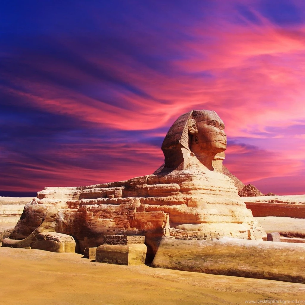 Wallpaper of Egyptian sphinx and pyramid on sunset.jpg