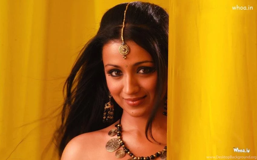 Trisha Krishnan Smiley Face with Yellow Background HD Wallpaper.jpg