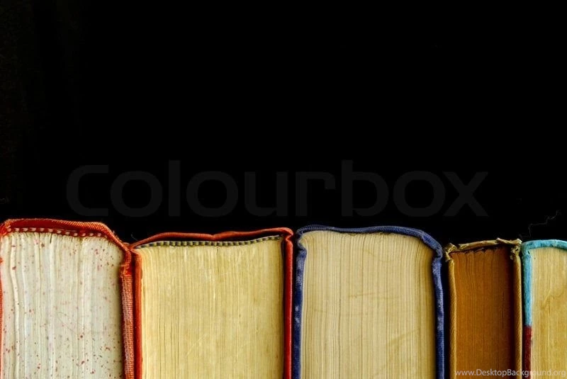 Looking At Row Of Books Across The Bindings Against A Black ...