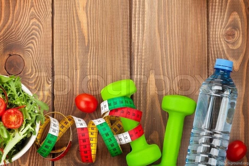 Dumbells, Tape Measure And Healthy Food Over Wooden Backgrounds ...