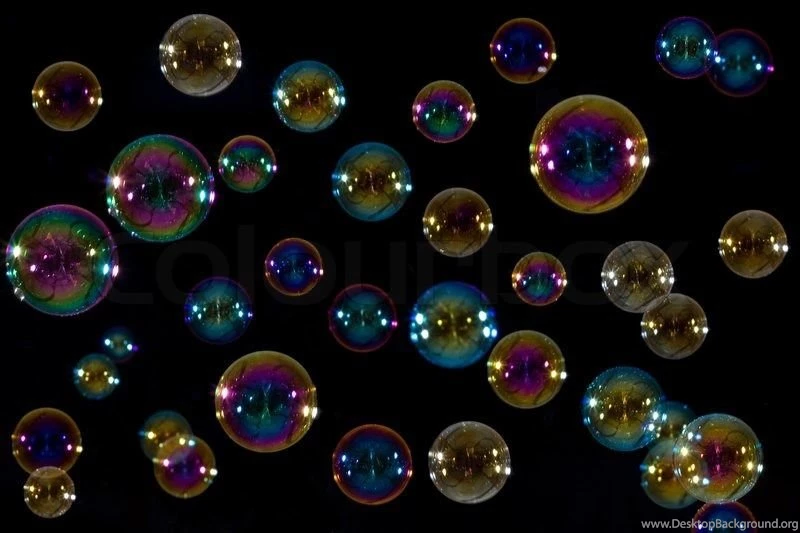 Soap Bubbles Floating In Front Of A Black Backgrounds