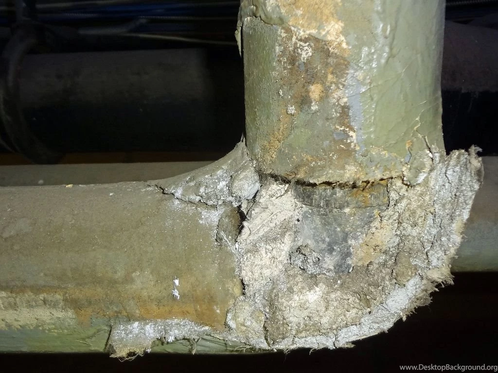 Damaged Asbestos Pipe Insulation At Pipe Elbow Fitting