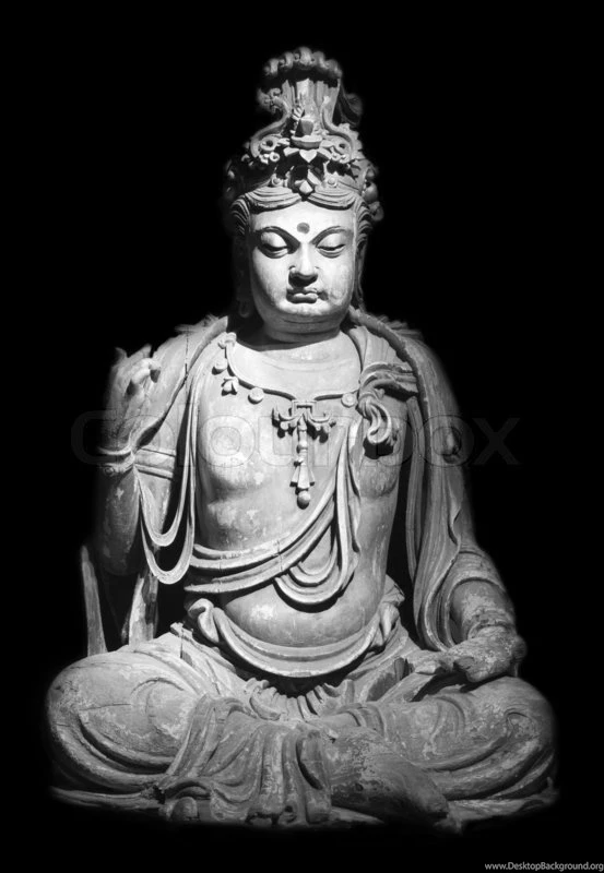 Statue Of Buddha Isolated Against Black Backgrounds