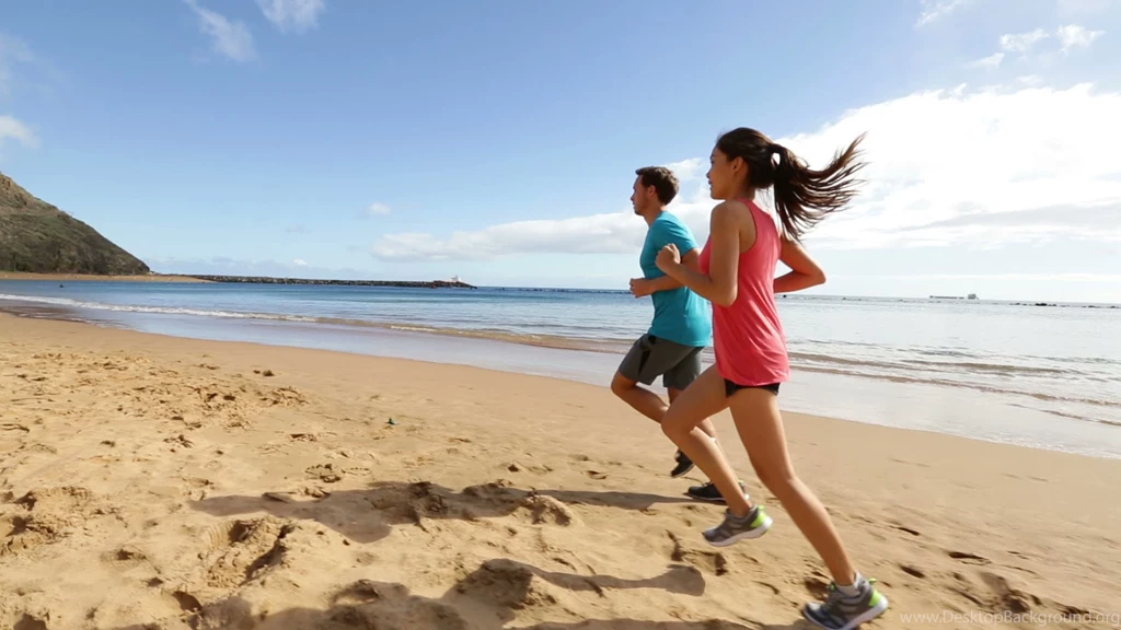 People running on beach jogging widescreen high definition ...