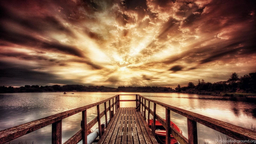 Boat Dock On A Lake Under Majestic Sunset (