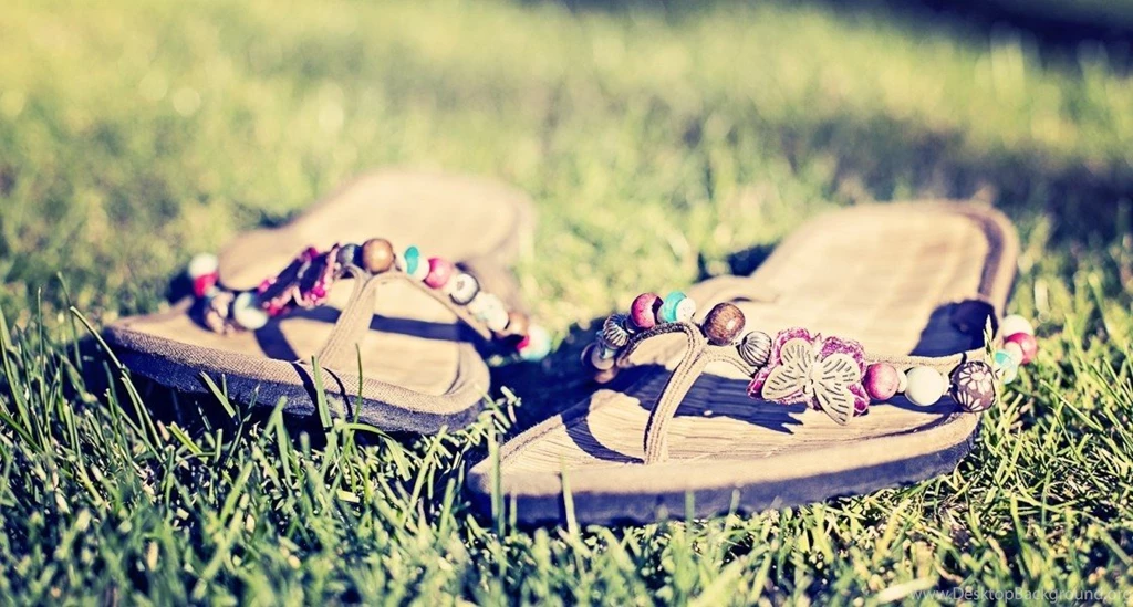 A Pair Of Flip Flops In The Grass