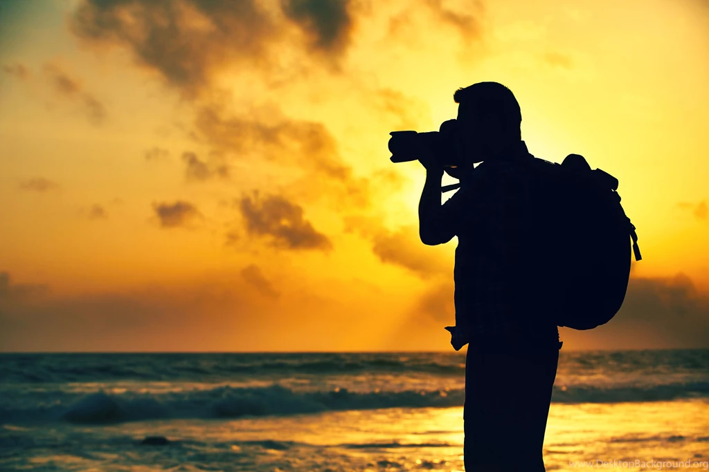 Adventurous Photographer Taking Beach Sunset Photos