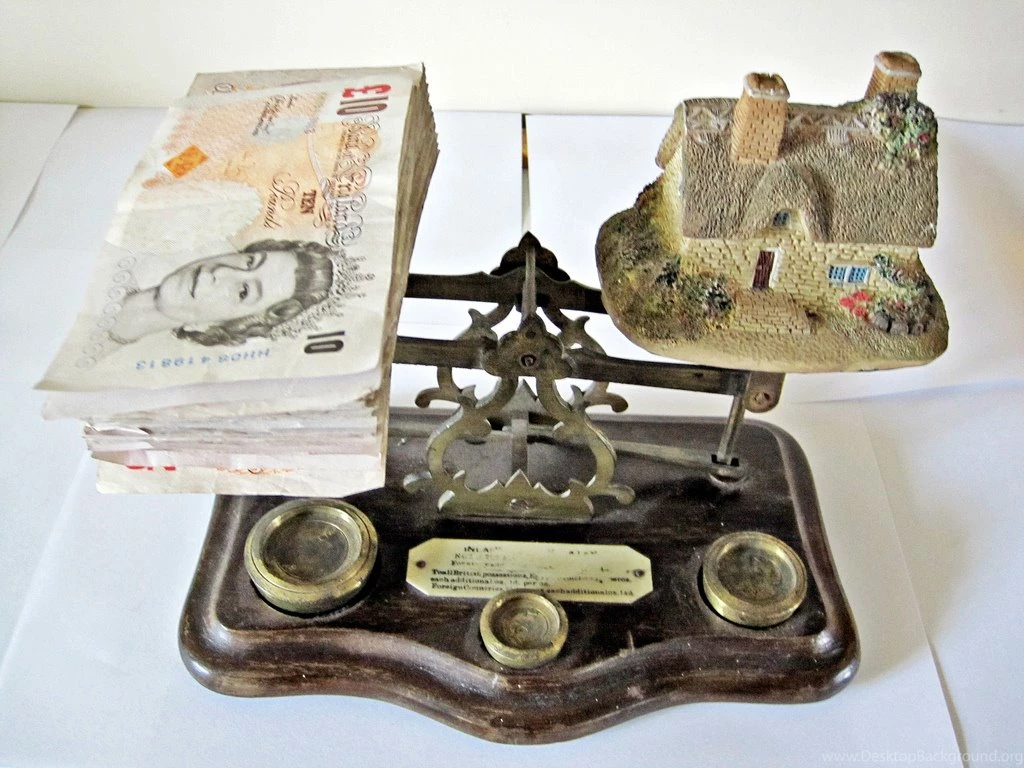 Money And House On Scales