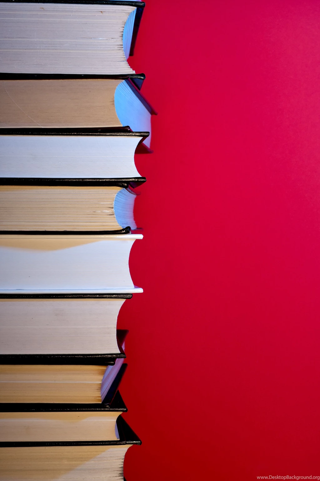 Stack Of Hardcover Encyclopedias Against Red Backgrounds