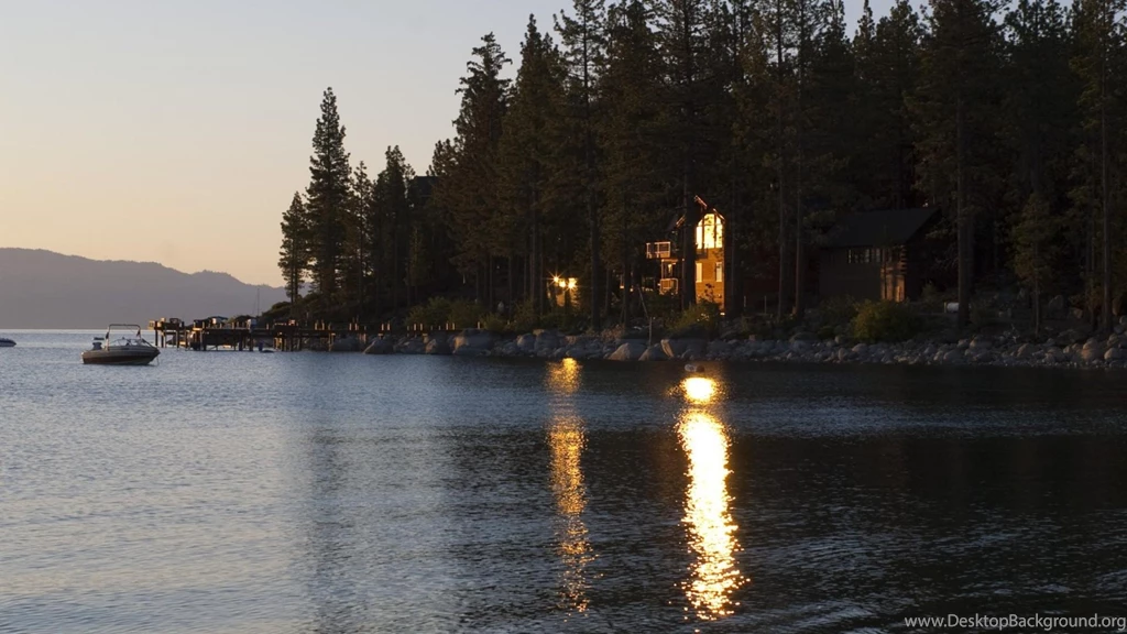 Morning Sun Reflecting Off A Lake House Window (