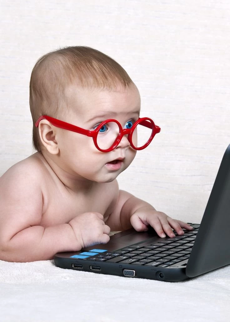 Cute Baby With A Laptop