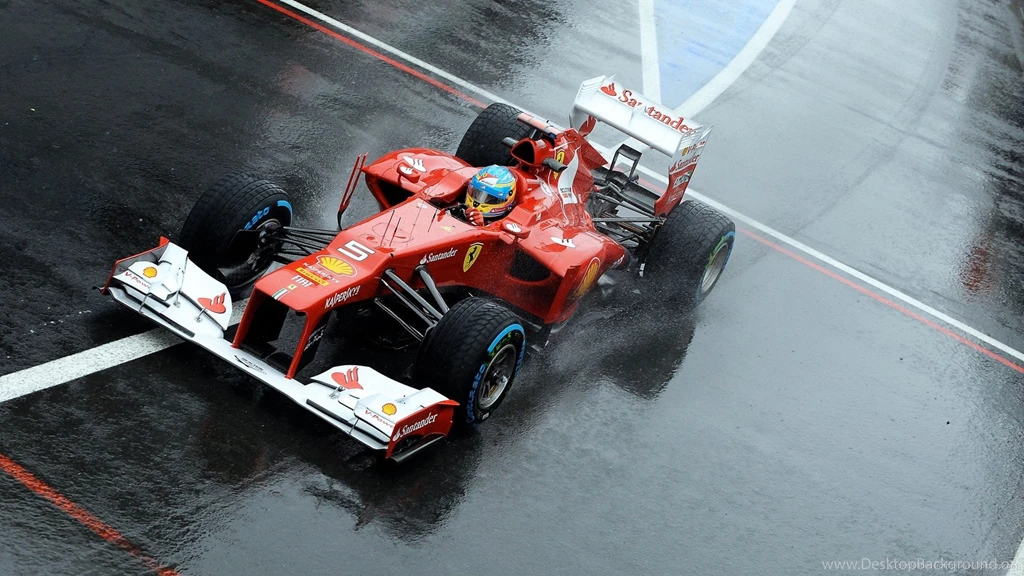 1024x600 Formula 1 Ferrari On A Wet Track Wallpapers