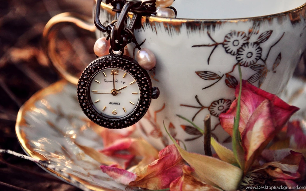 Old Clock Hanging From Cup