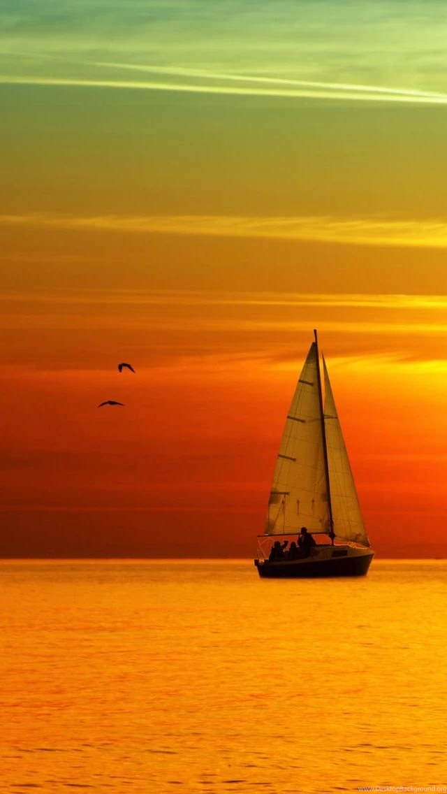 Glowing Ocean Beach Sunset Sailboat iPhone Wallpapers