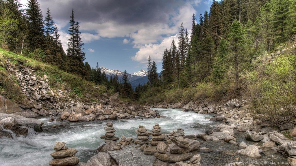Stone Cairns Along A Beautiful Mountain Stream (