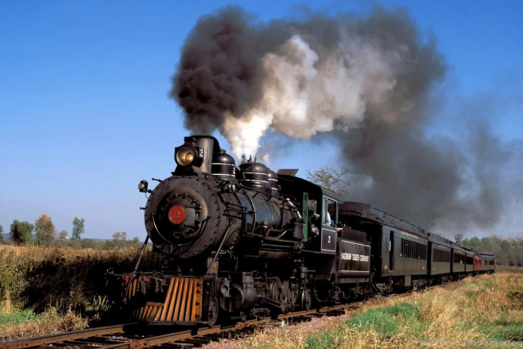 Steam Locomotive Passing Through Desert