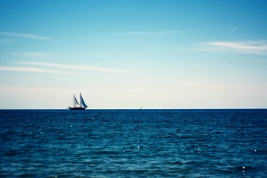 Boat Sailing In The Blue Sea Wallpapers