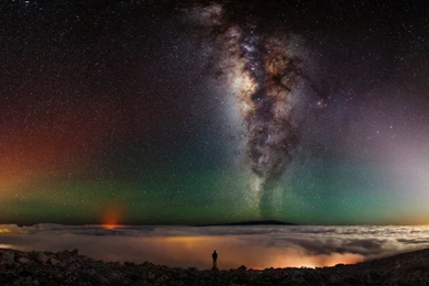 Man Standing At Edge Of Volcano With Milky Way, Planets In ...