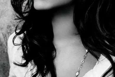 Download Rihanna Sitting Near The Wall Wallpapers For iPhone 4