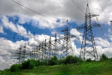 Electric Power Lines On A Blue Sky Backgrounds Tower Stock Photo