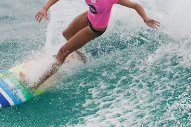 Girl In Pink T Shirt Surfing 640x1136.jpg