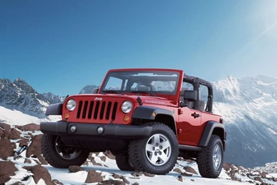 Download Red Jeep Wrangler In Snowy Mountains Wallpapers For iPad 2