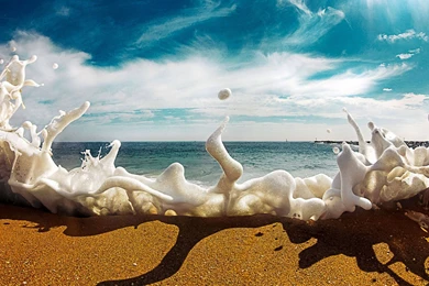 Sea Foam Crashes Over The Sand. : Pics
