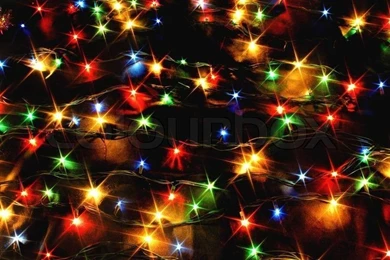 Xmas Backgrounds With Color Lights On The Black Backgrounds