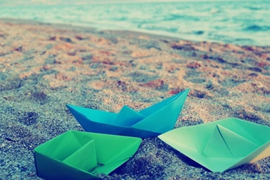 Download 1024x768 Paper Boats On A Beach Sand Wallpapers
