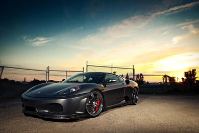 Black Ferrari Car on Stony Road It is Bright Shinning and Full of Metallic Sence Want a Drive HD Cars Wallpaper.jpg