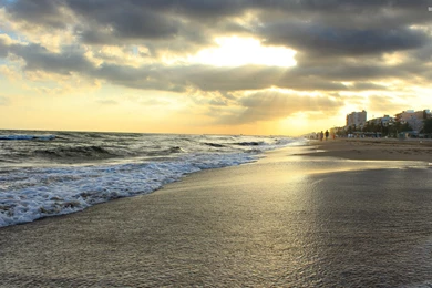 Sunset On The Beach Near The City Wallpapers   Beach Wallpapers ...