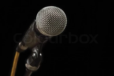 Classic Black Microphone On Black Stand. Isolated Black Backgrounds ...