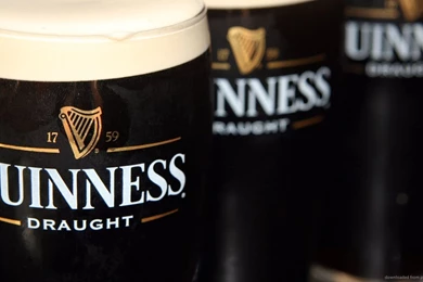 Download 1366x768 Three Full Guinness Draught Glasses Wallpapers