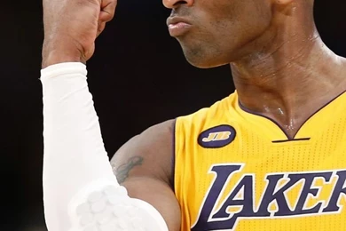 Download Kobe Bryant Wearing A White Sleeve Wallpapers For iPhone 4