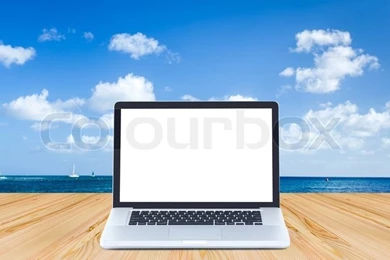 Blank Screen Laptop Computer On Wood Floor With Ocean And Blue Sky ...