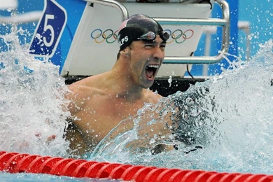 Michael Phelps Celebrates Winning Gold